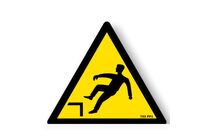 Danger sign with picture of risk of falling on an uneven surface