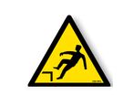 Danger sign with picture of risk of falling on an uneven surface