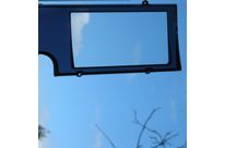 Transparent dual-material automobile glazing