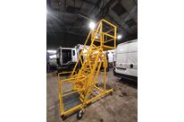Mobile ladder for accessing waste skips