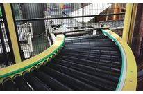 Motorized curved conveyor without contact