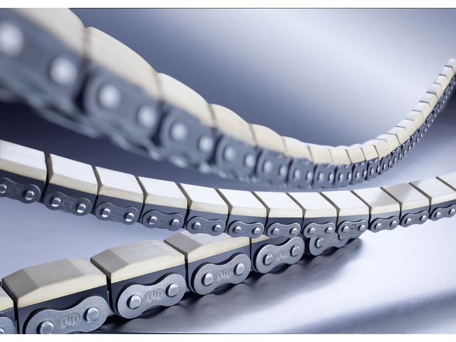 Roller chain with vulcanised elastomer profiles